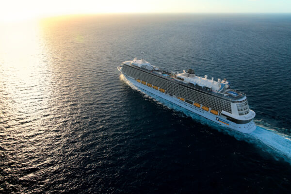 AN, Anthem of the Seas, Come Seek shoot Dec 2015 in Bahamas, aerials, at sea, ship exterior, 3/4 view from above, port side, aft, rear, very bright sunset over ocean